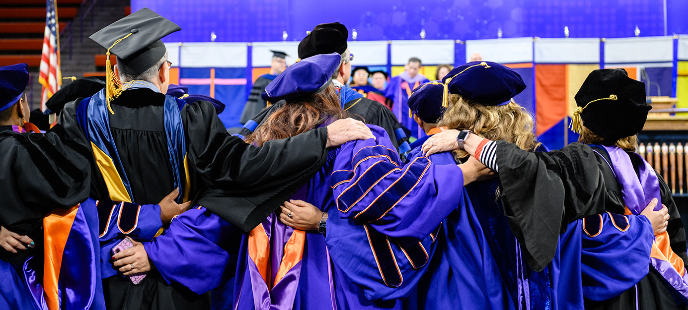 A student stands in front of the Clemson Rural Health truck