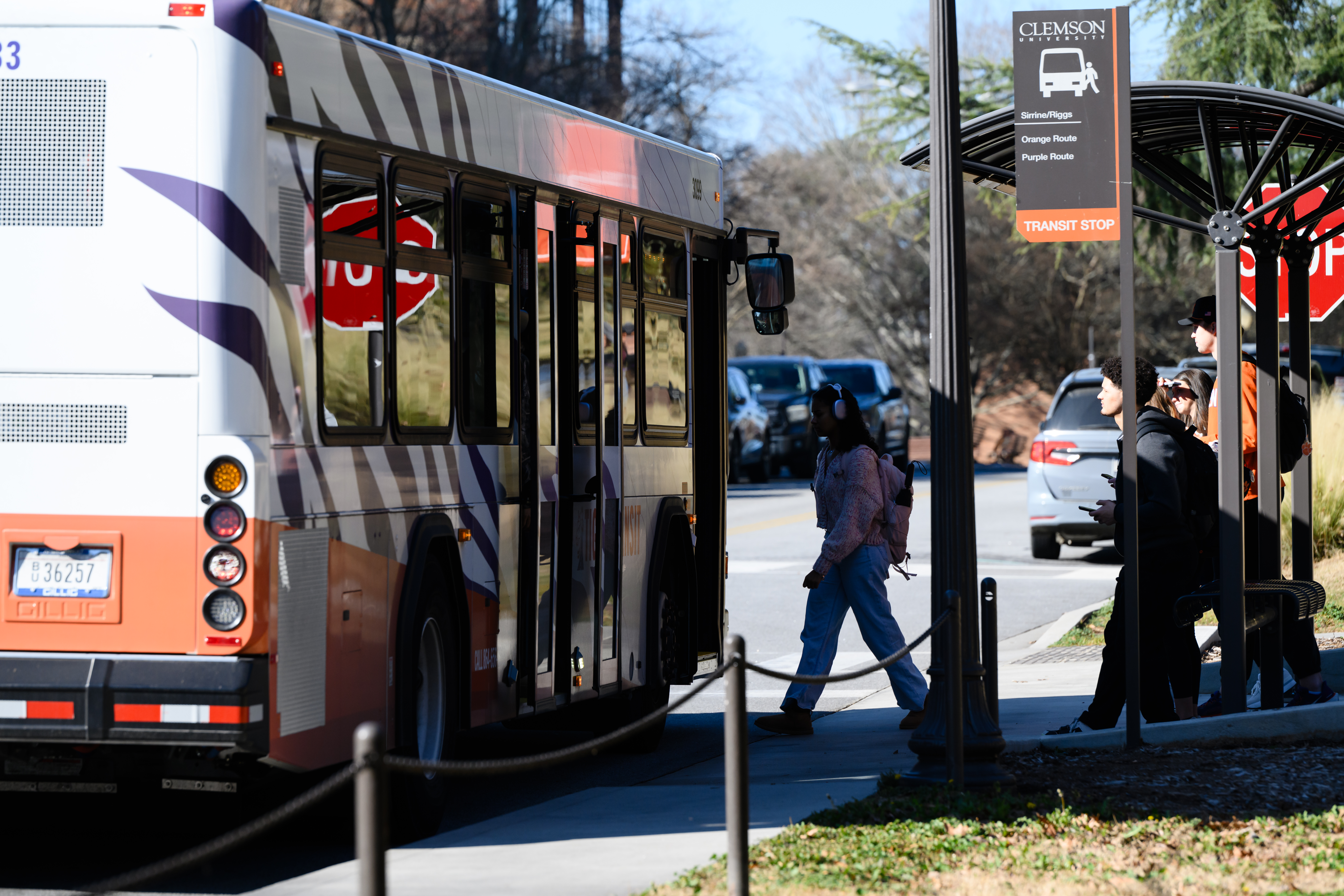 A student boarding the tiger transit bus on campus