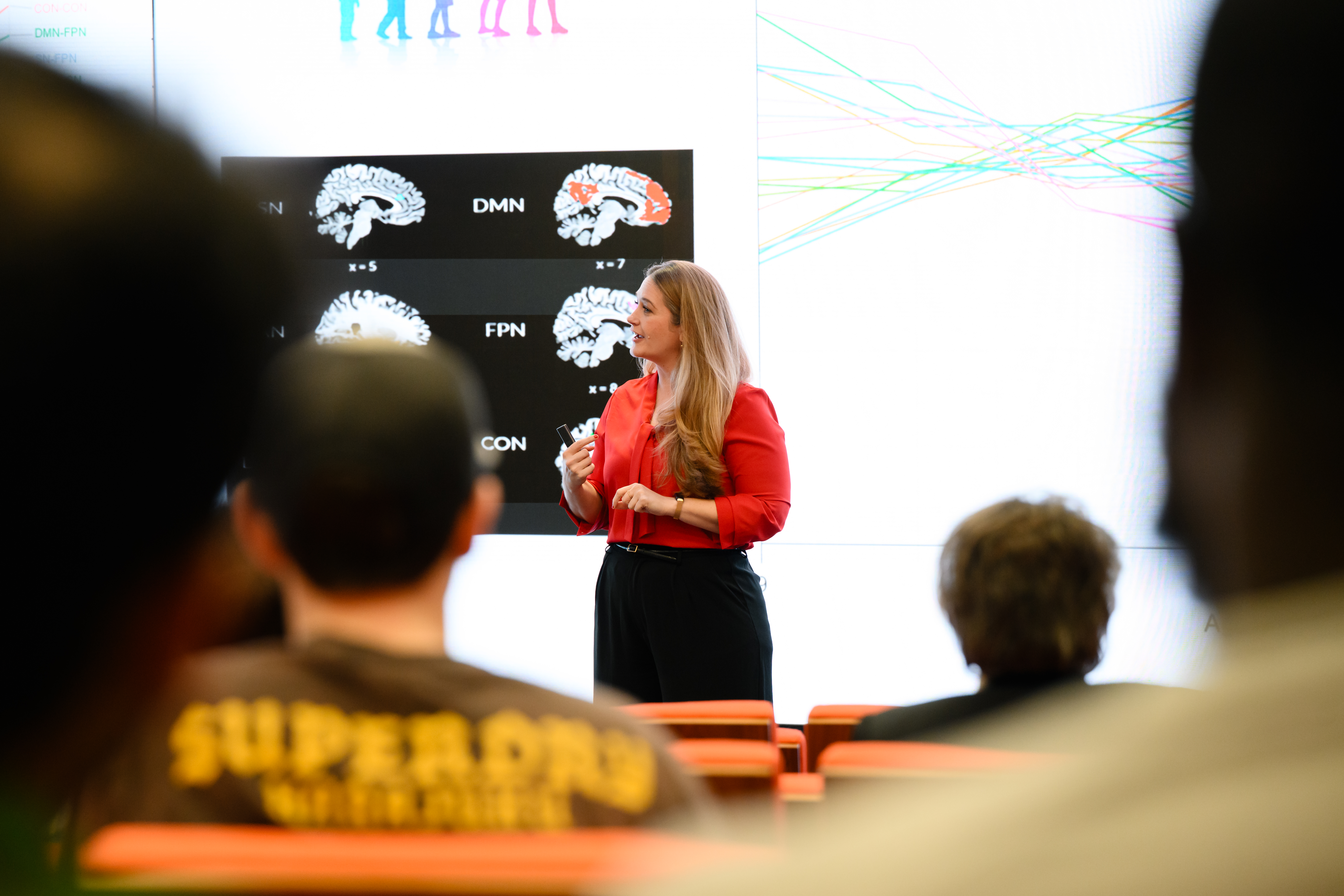 Graduate researcher presenting their research to an audience
