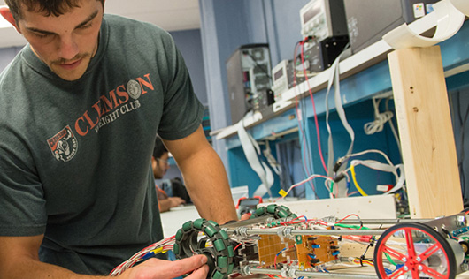 Student working on electric car