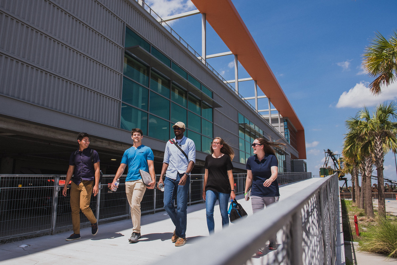 Students walking and talking in front of the Zucker Center