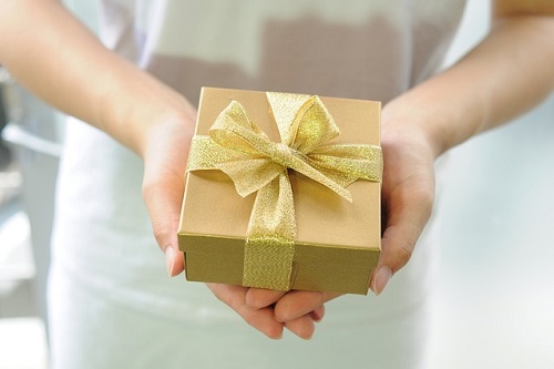 Person giving gift box