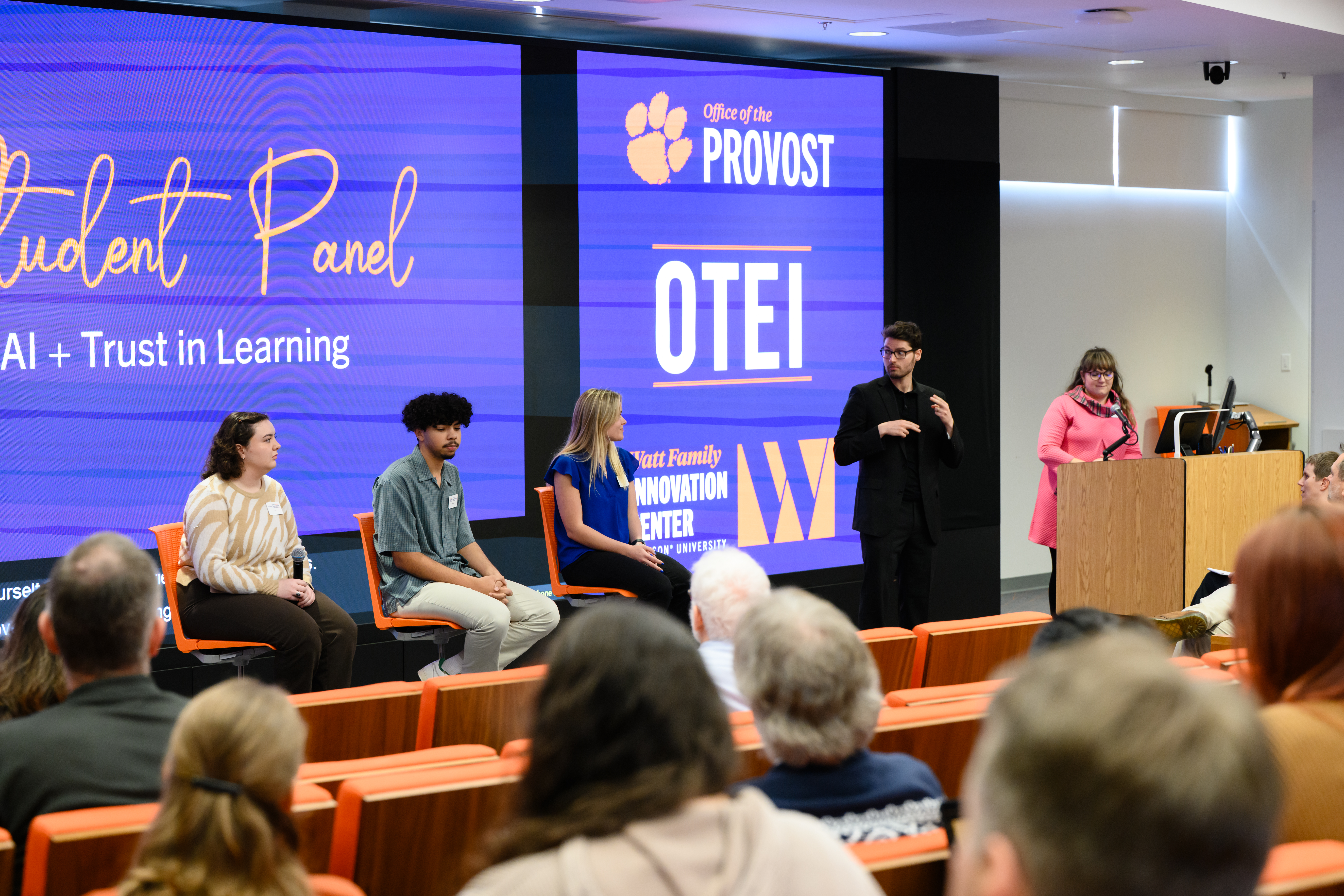 Clemson faculty working at workshop together.