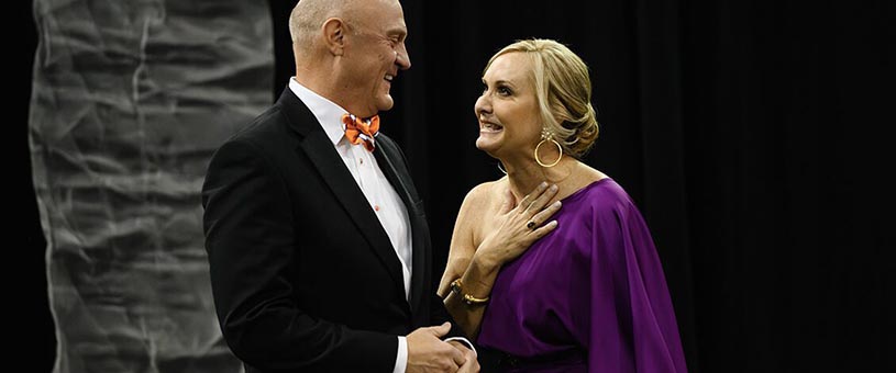 President and First Lady Clements smile together at an event 