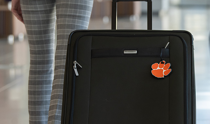luggage with clemson tiger paw on it.