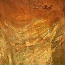 image of gneiss rock that has undergone iron oxidation (rusting)