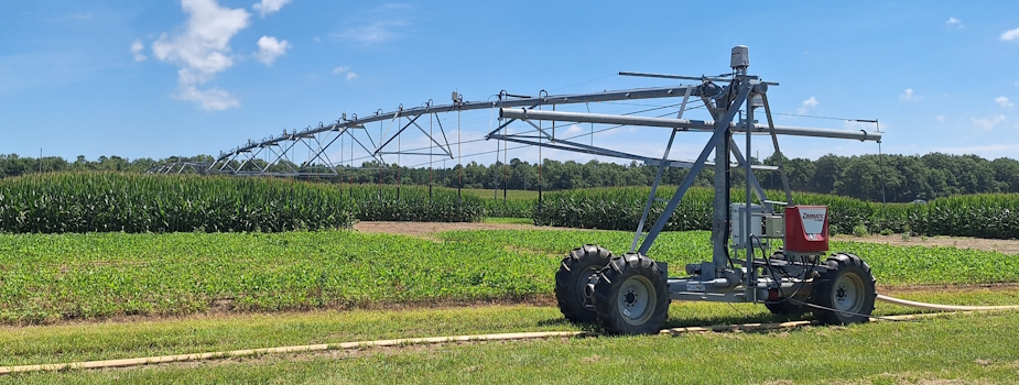 irrigation sprinkler spraying a field of crops