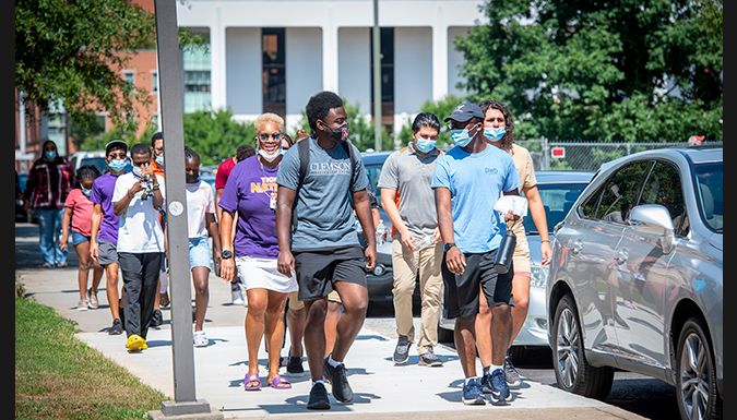 Students walking on campus-diverse backgrounds