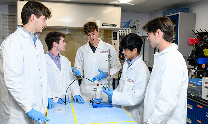 DEBUT challenge winners - 5 students in a research lab