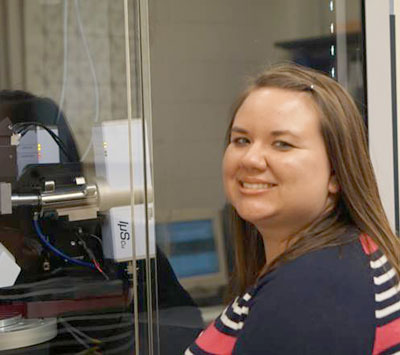 Dr. Tiffany Pellizzeri is pictured with the chemistry department’s new Bruker D8 Venture Photon 100 single-crystal diffractometer which she uses to identify the single-crystal products she synthesizes in the lab.