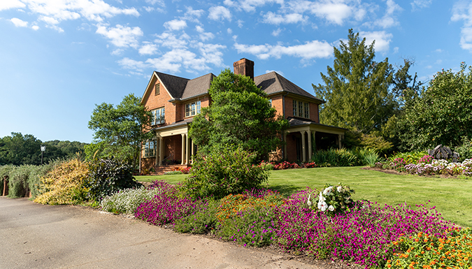 fran hanson visitors center on sunny day with beautiful blooming flowers