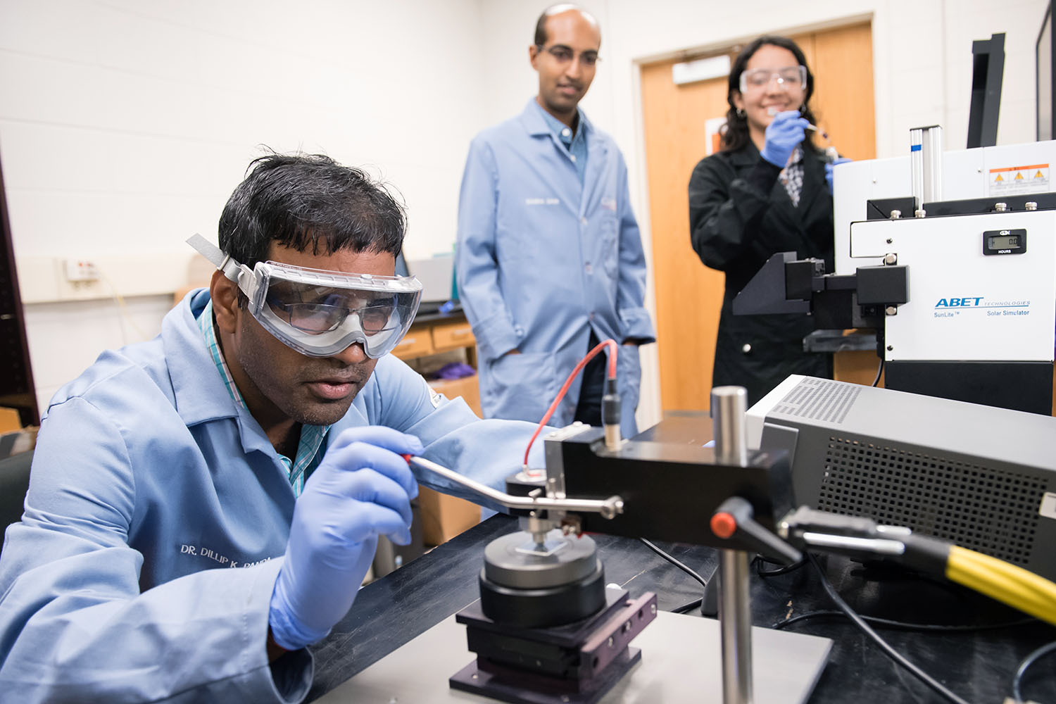 Two men, one woman in lab.