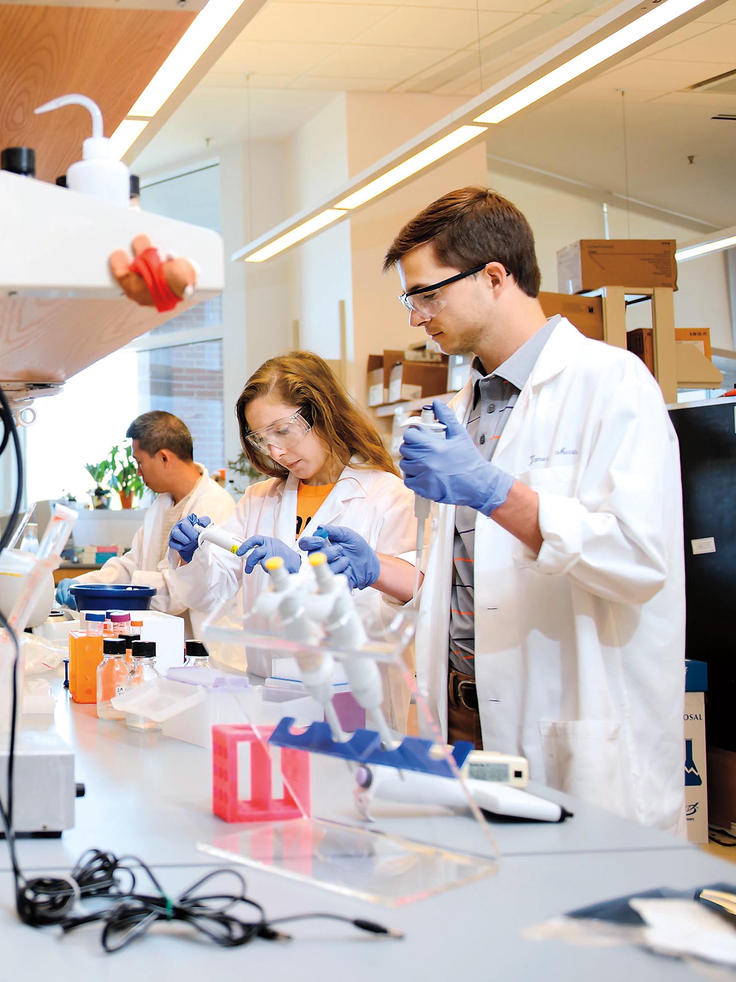 Students working in a lab at a workstation.