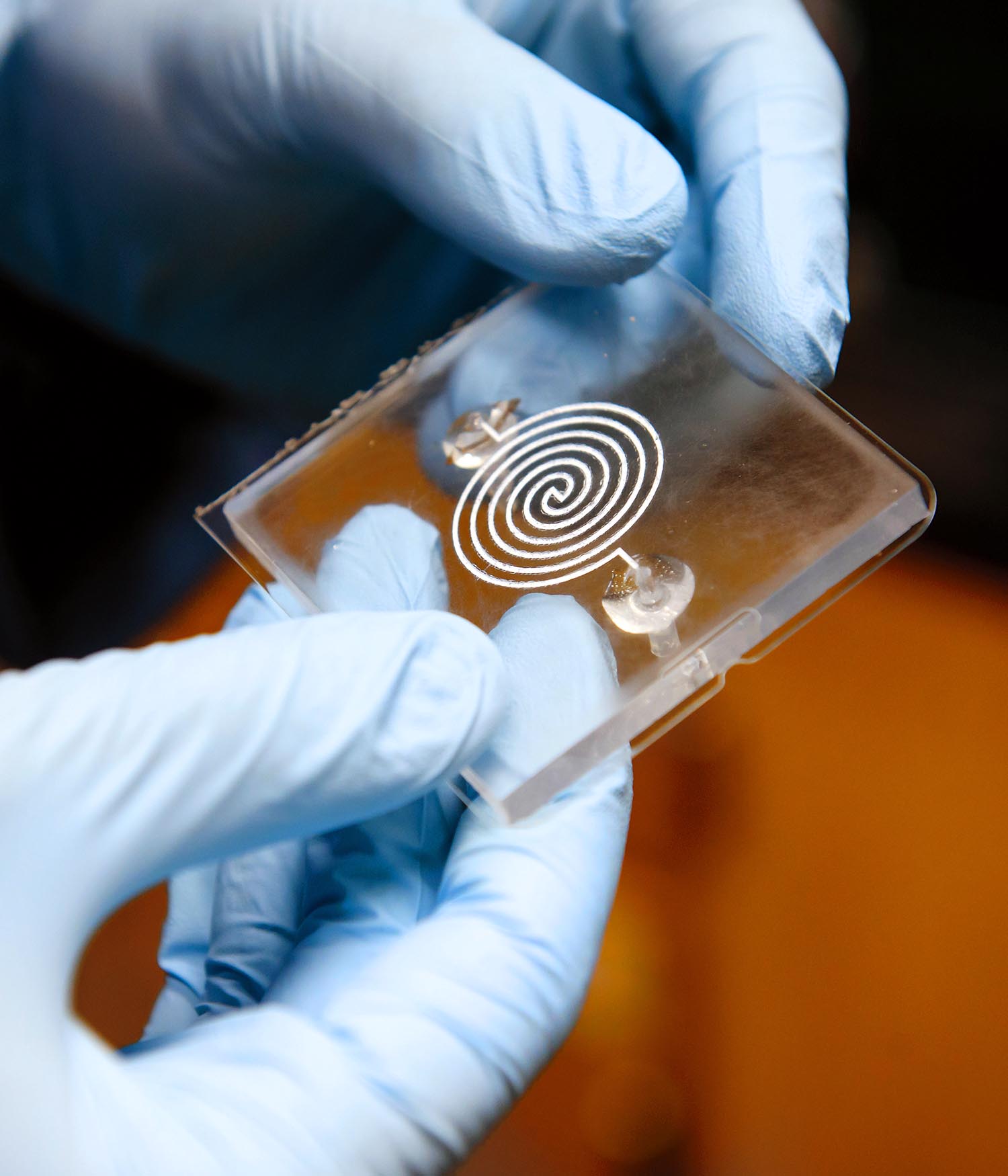 Lab user holding glass slide