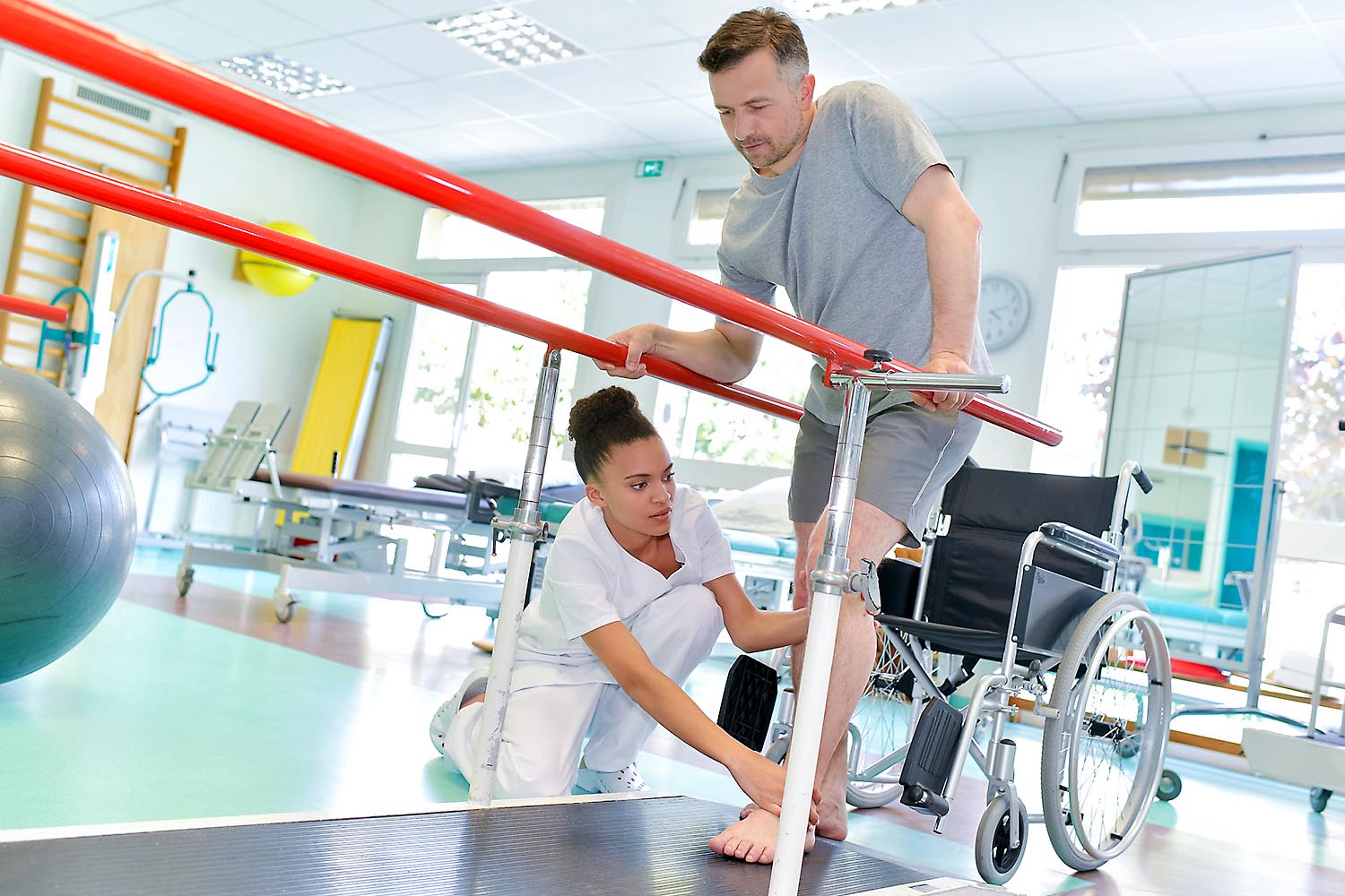 Occupational therapist working with patient.