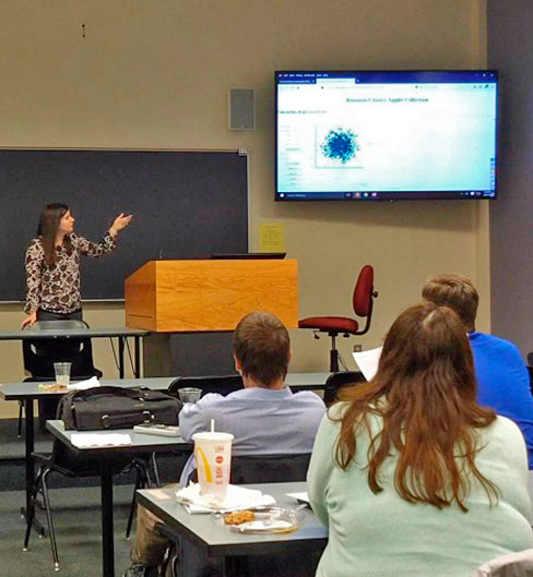 Teacher taking to a small group of educators.