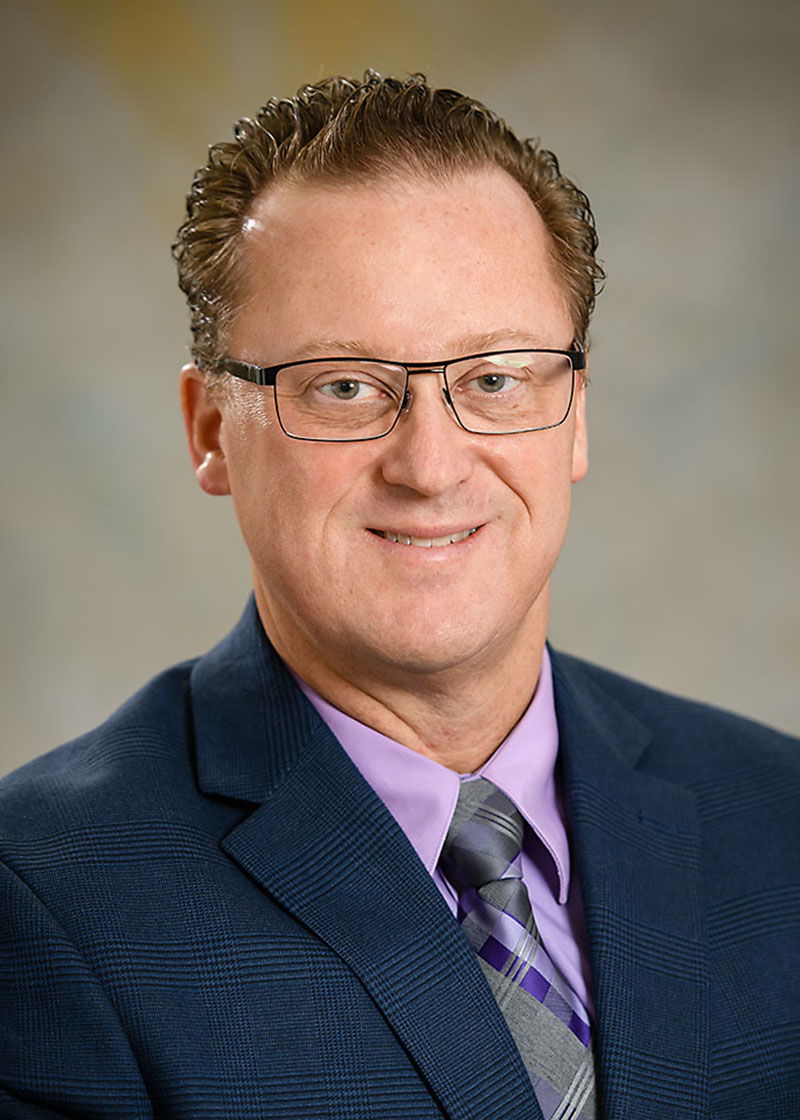 Headshot of man, Kevin James.