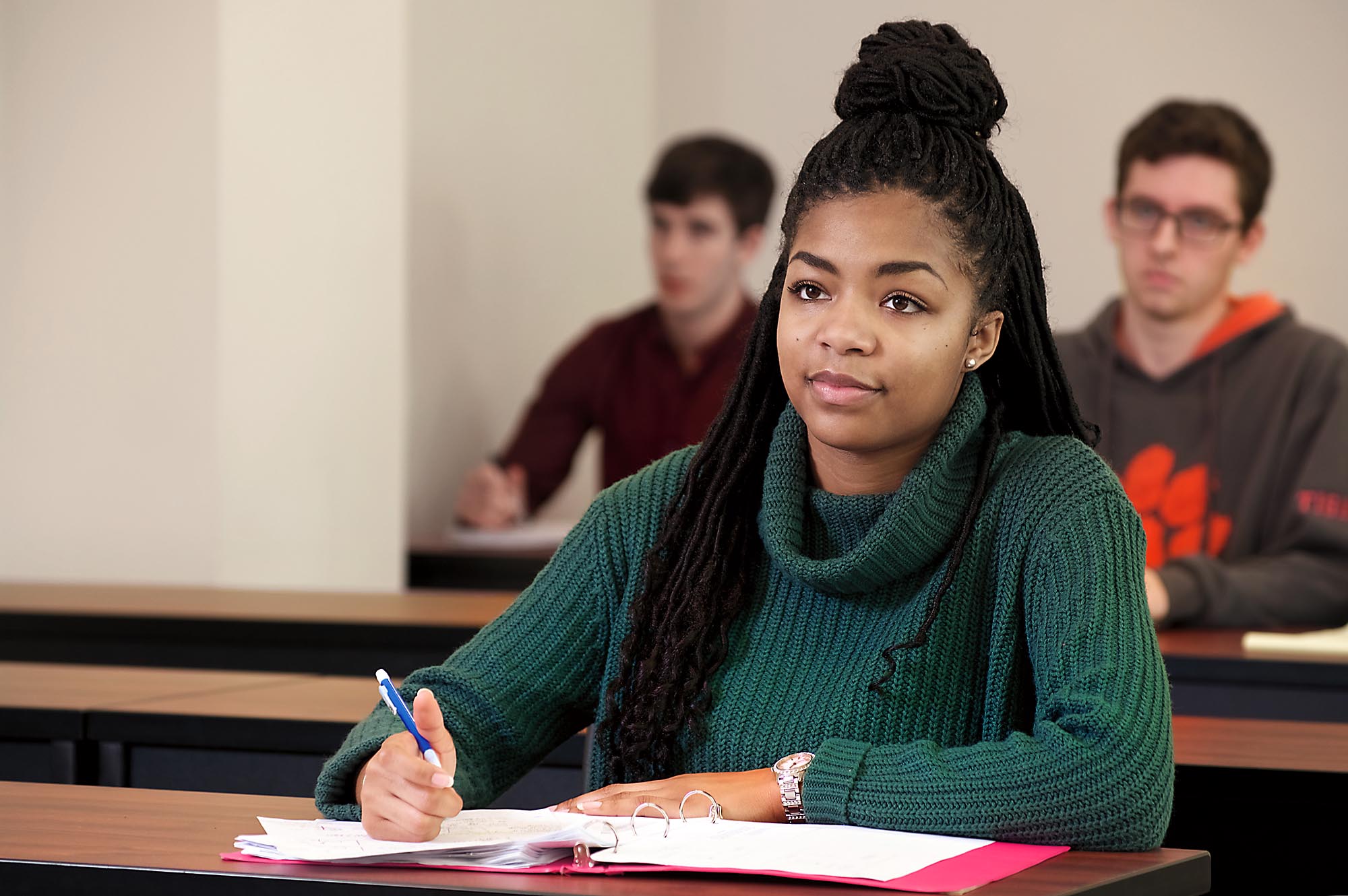 Student at desk in science classroom.