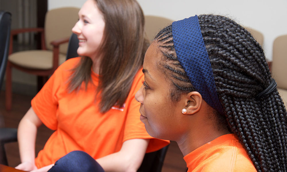 Two students listening