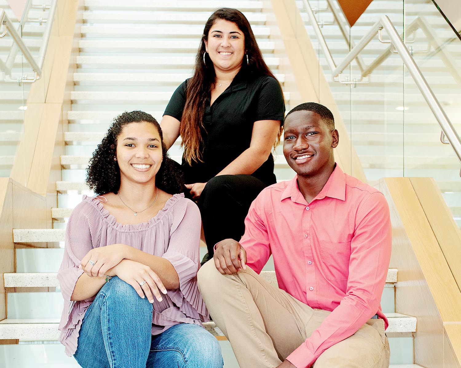 Three students on stairs in Life Sciences Building