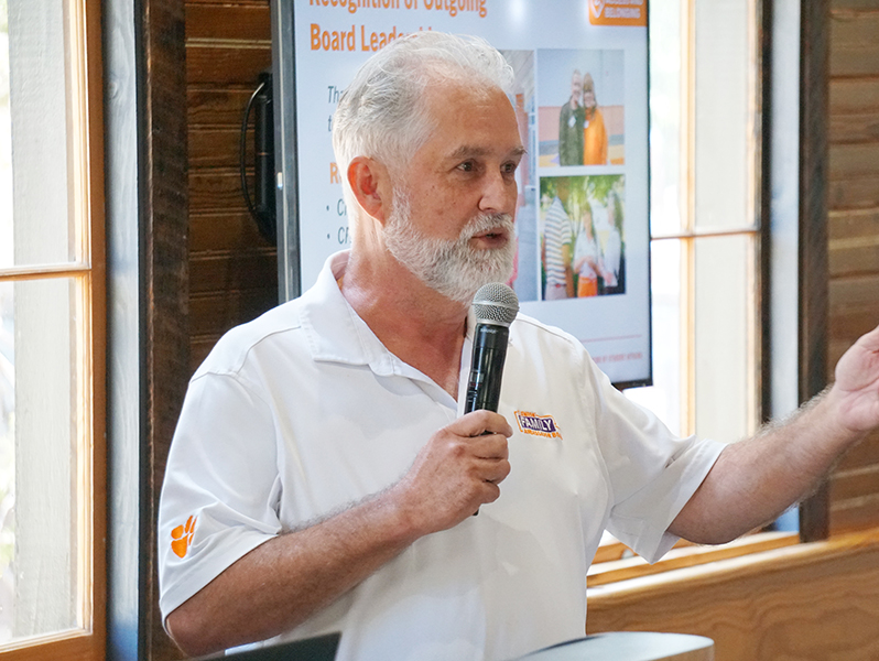 A male member of the Clemson Family Ambassador Board speaks during a meeting