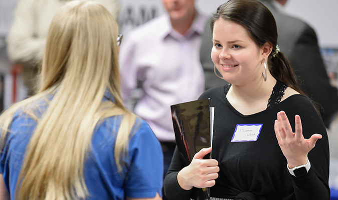 Student Interacting with Staff