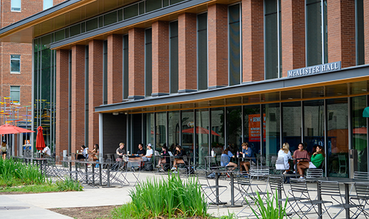 Students eat outside of McAlister dining hall