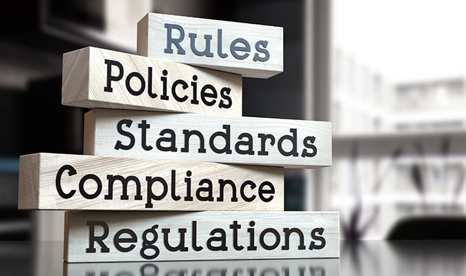 Signage on a desk outlining the importance of rules and regulations