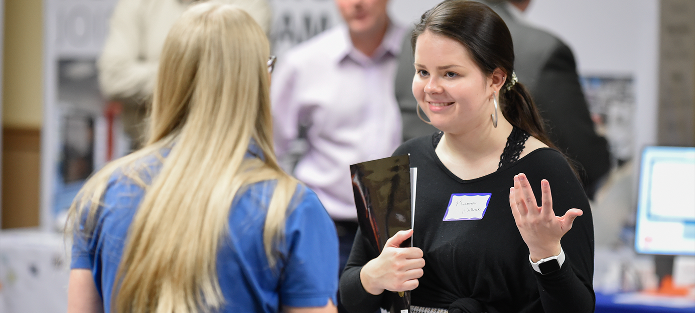 Student interacting with Staff