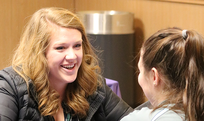 Student in discussion with Staff at Tiger Connect event 2020