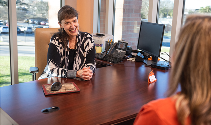 Kathy Cauthen in discussion with a student
