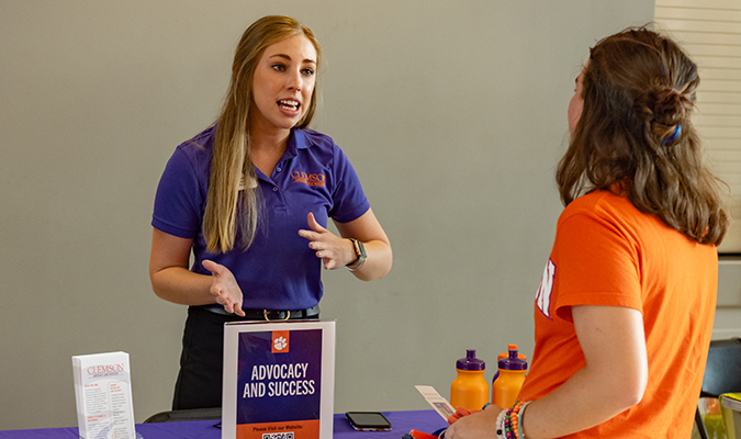 Makayla Stark speaks with a student