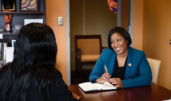 Dr. Poole in discussion with a student