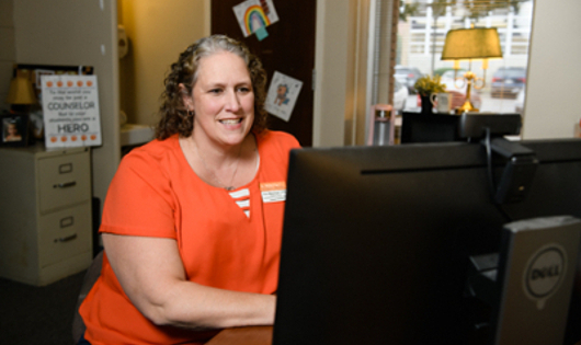 a CAPS provider on her computer during a Telehealth session