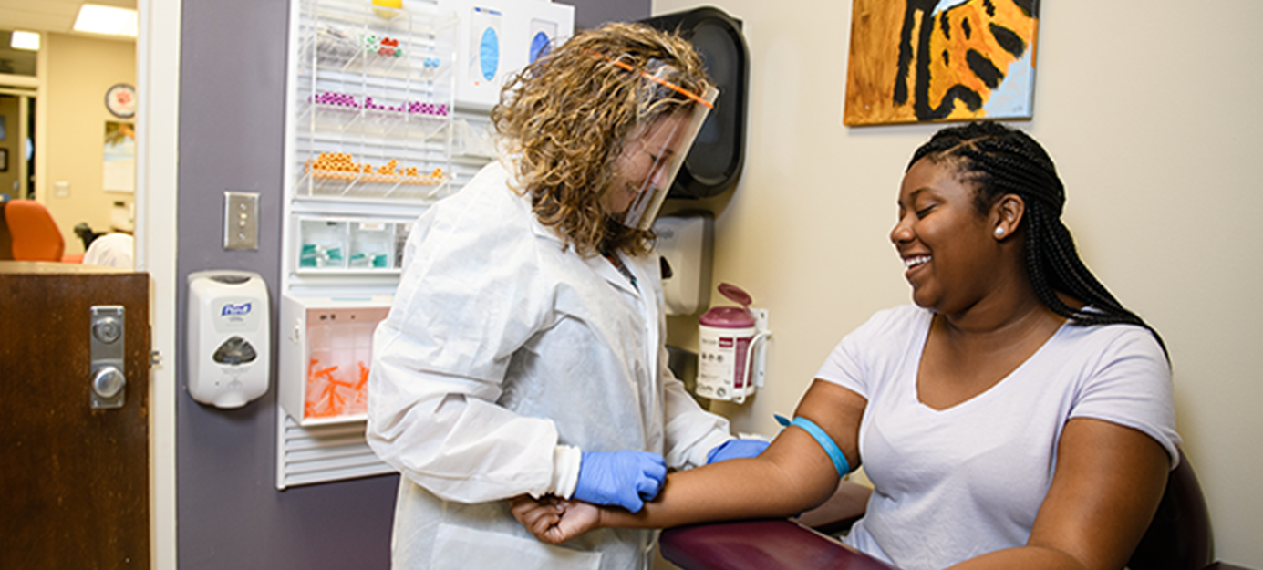 Student getting examined at Redfern Health Center