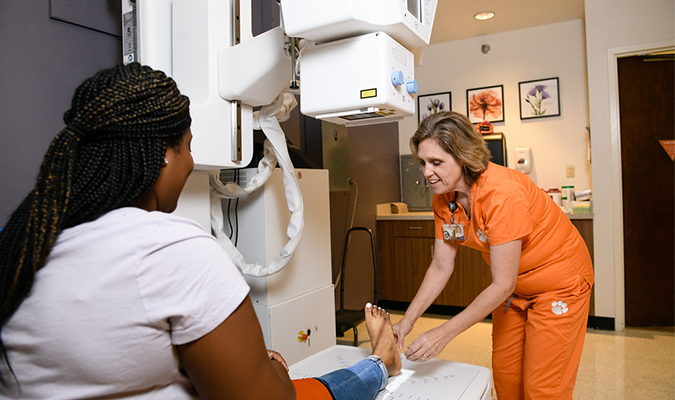 Student getting examined at Redfern Health Center