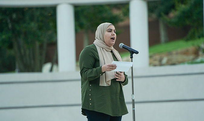 Student giving speech at Silent Roar