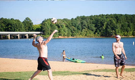 Students playing Volleyball at Snow Beach