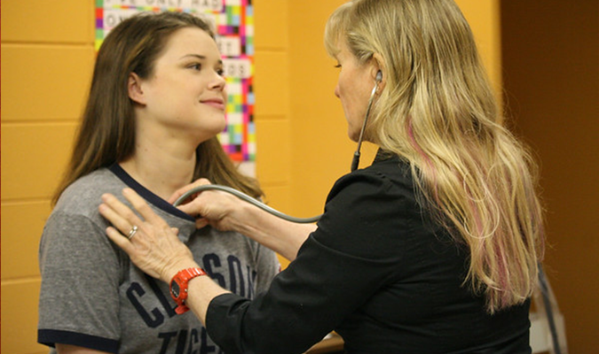 Student getting checked at Redfern Health Center