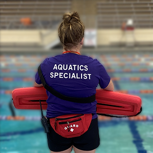 lifeguard standing in front of a pool