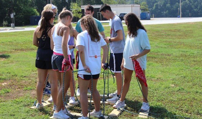 Group of students doing a teambuilding activity