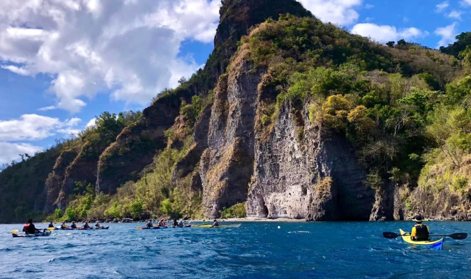 kayaking in front of a mountain