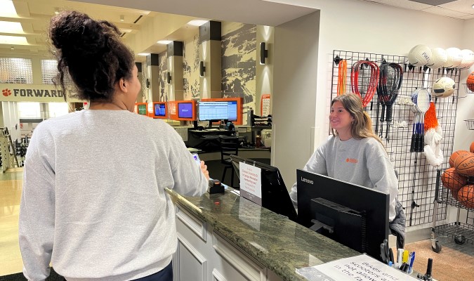 Student scanning in at Fike front desk