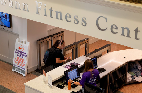 staff assisting a customer at the desk