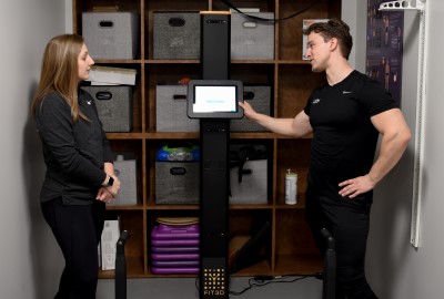 personal trainer explaining how to complete fit3d scan
