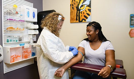 Student getting examined at Redfern Health Center