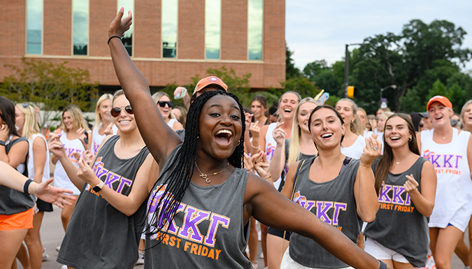 Clemson students parading and cheering at the First Friday Parade