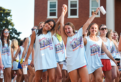 Clemson students participating in the First Friday Parade and marching with their sorority