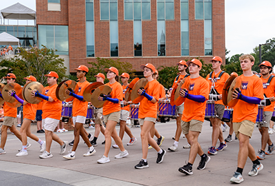Clemson students band group in the First Friday Parade