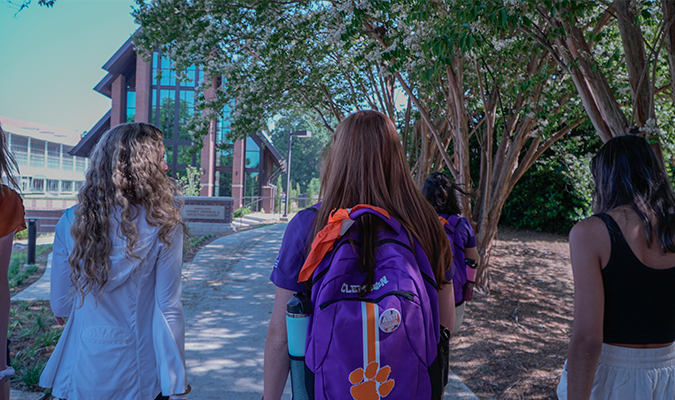 Students walking near Samuel J. Cadden Chapel